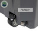Image of large hard-shell storage dry box wheel detail with dual wheels for easy mobility, dark gray rugged plastic construction shown in close-up angled view on white background.