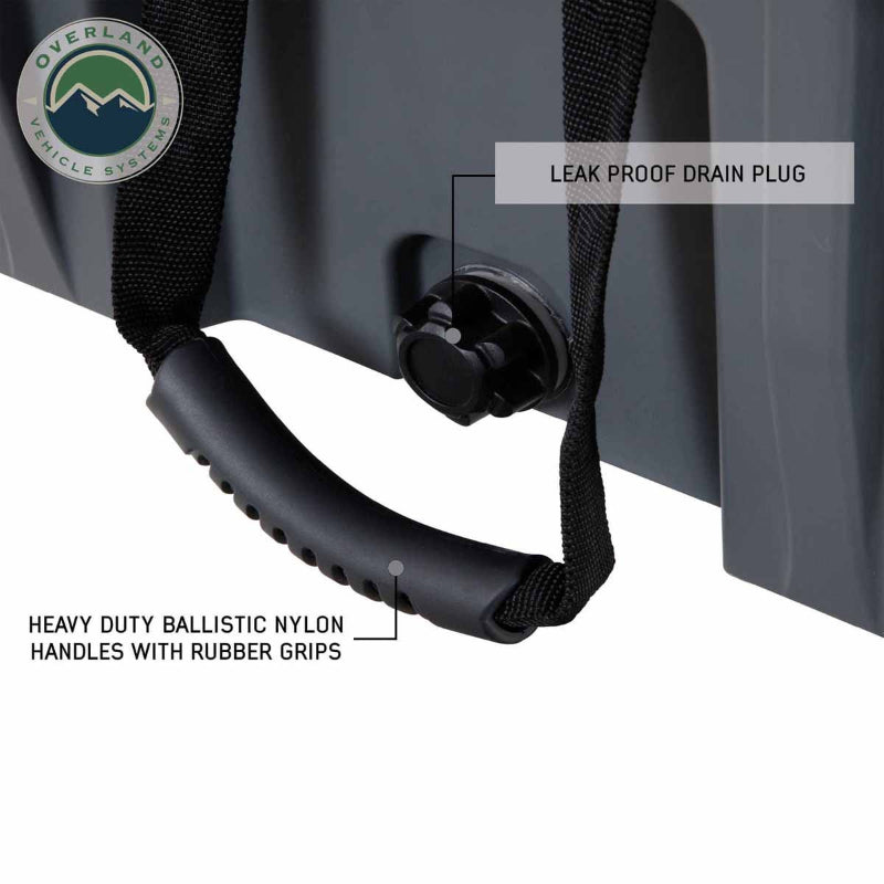Image of hard-shell storage dry box side detail with leak-proof drain plug and heavy-duty ballistic nylon handle with rubber grip, dark gray rugged plastic construction shown in close-up angled view on white background.