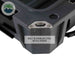 Image of hard-shell storage dry box corner detail with built-in stainless steel bottle opener, dark gray rugged plastic construction shown in close-up angled view on white background.