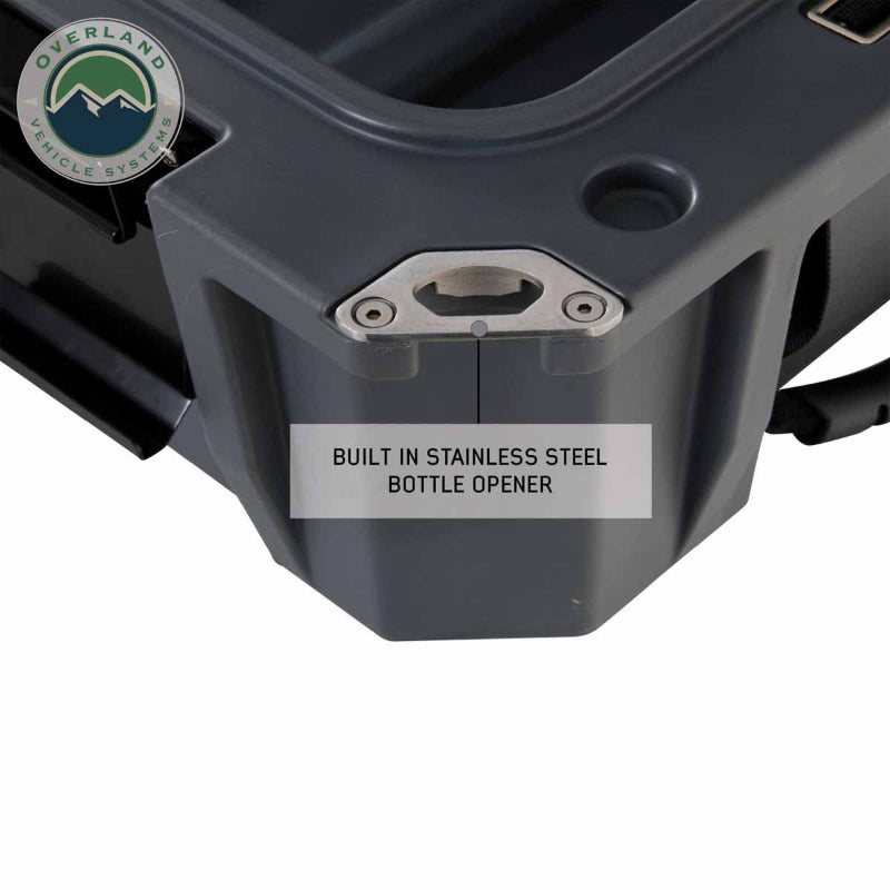 Image of dry box corner with built-in stainless steel bottle opener integrated into dark gray storage box, close-up angled side view on white background.