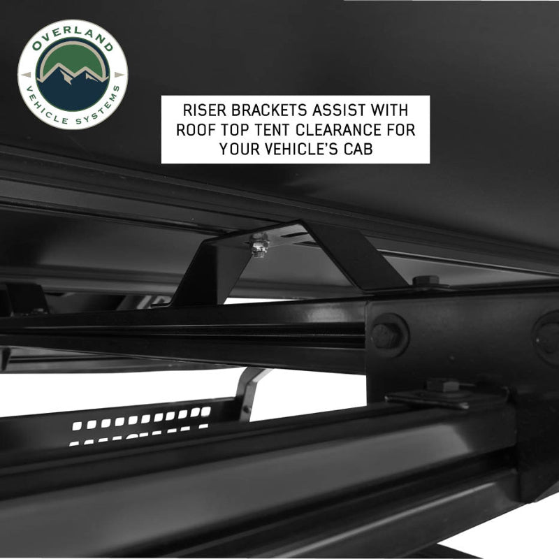 Image of Overland Vehicle Systems roof rack showing riser brackets designed to assist with rooftop tent clearance for the vehicle’s cab, close-up view with a text overlay highlighting the feature