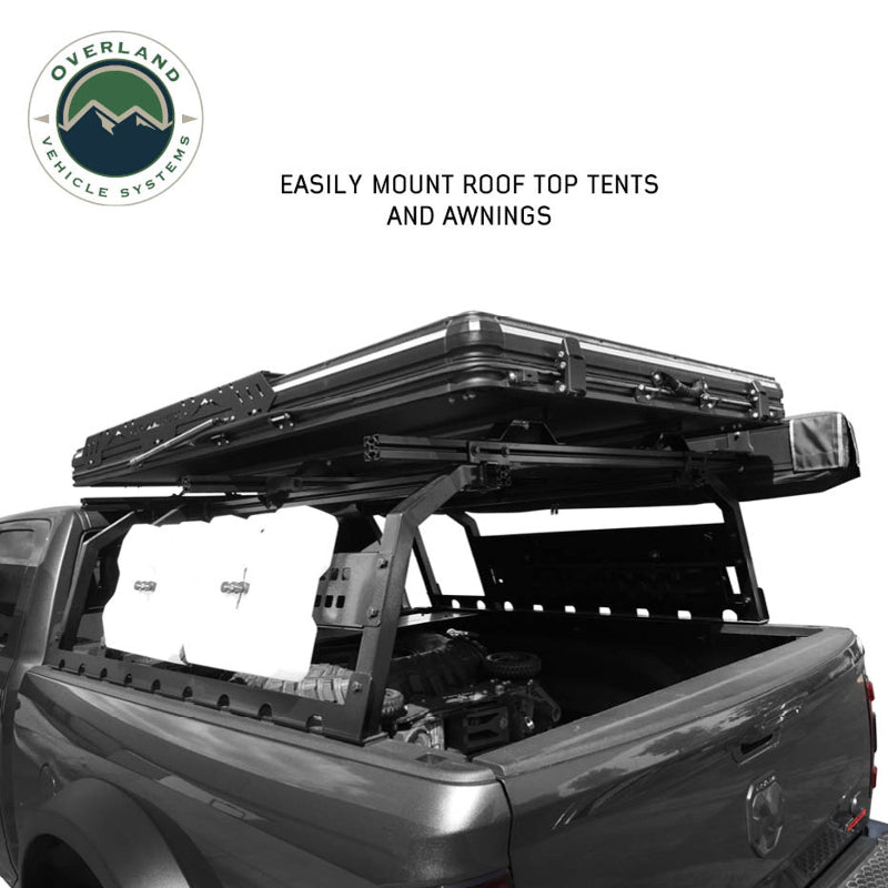 Image of Overland Vehicle Systems roof rack mounted on a truck with rooftop tent and awning, side view with a text overlay highlighting easy mounting of roof top tents and awnings