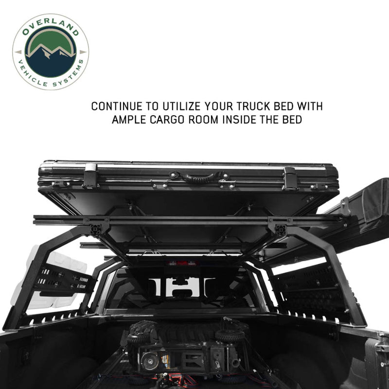 Image of Overland Vehicle Systems roof rack mounted on a truck with rooftop tent, showing ample cargo space inside the truck bed, side view with a text overlay highlighting continued utilization of the truck bed space