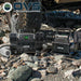 Image of OVS portable digital air compressors in use during off-road tire inflation, black units with digital displays and coiled hoses, placed on rocky terrain beside a vehicle tire in an outdoor setting.