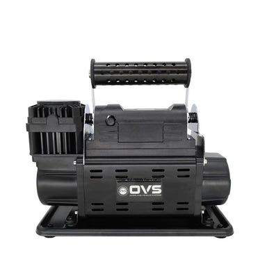 Image of OVS portable digital air compressor with integrated carry handle and mounting base, black housing with ventilation slots, front-facing view on white background.