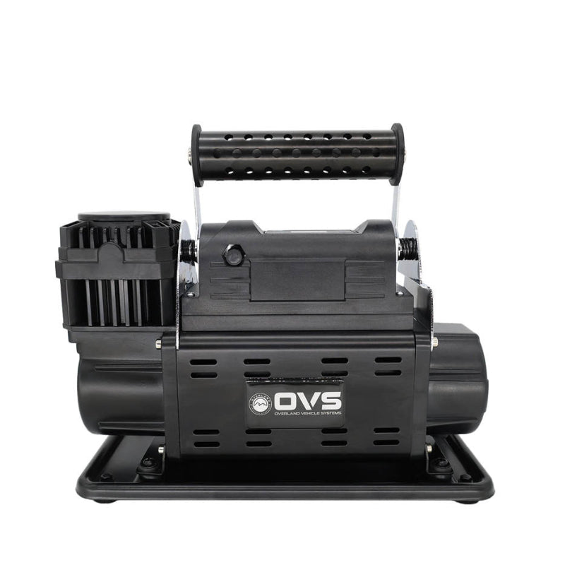 Image of OVS portable digital air compressor with integrated carry handle and mounting base, black housing with ventilation slots, front-facing view on white background.