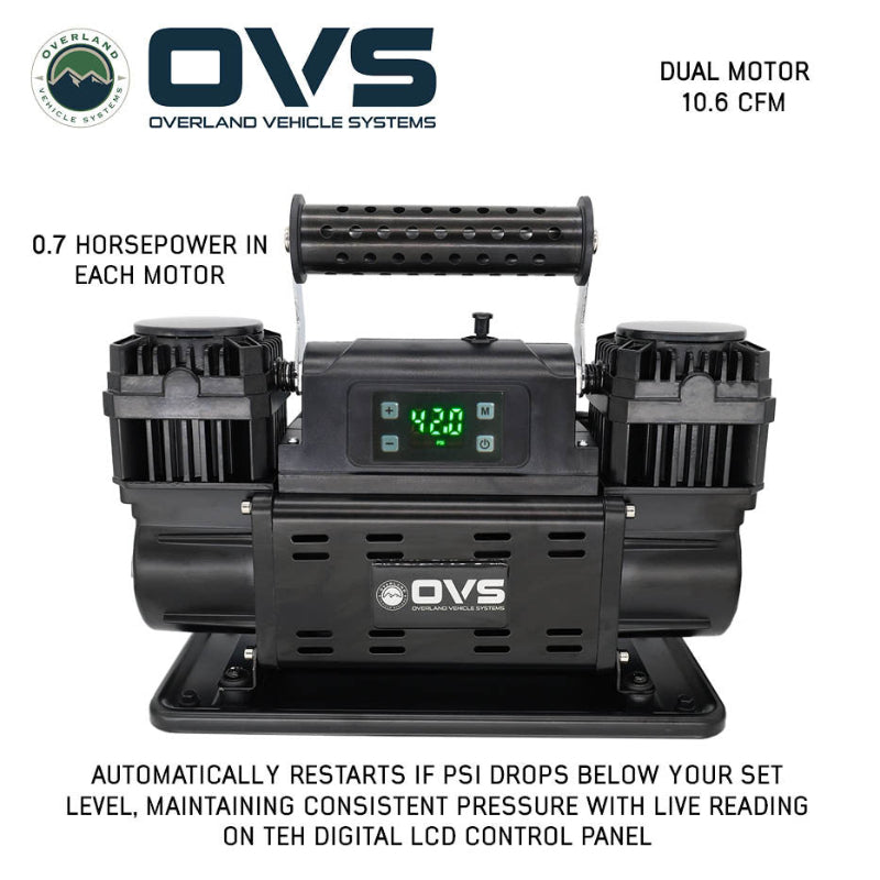 Image of OVS dual motor portable digital air compressor with illuminated LCD display, perforated carry handle, and mounting base, front-facing view on white background.