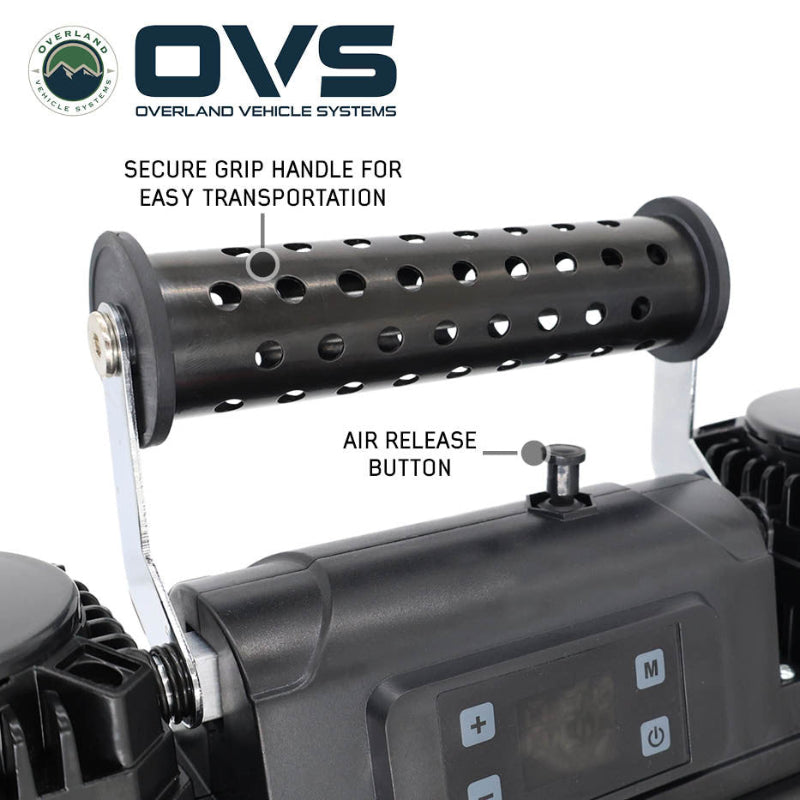 Image of OVS portable digital air compressor showing perforated grip handle and air release button, close-up angled top view on white background.