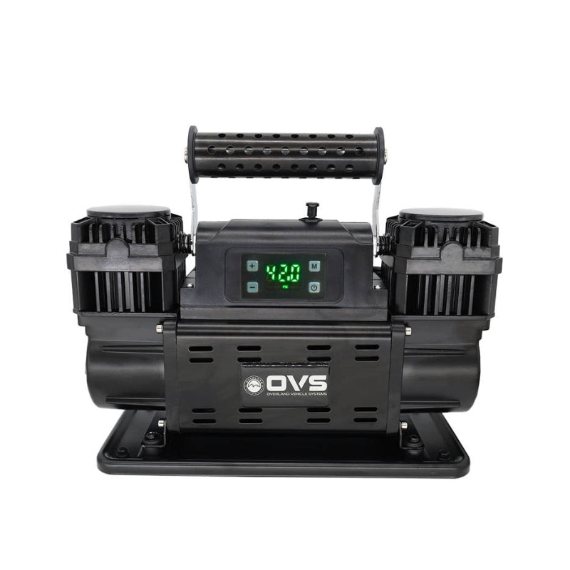 Image of OVS portable digital air compressor with dual motors, perforated carry handle, illuminated digital display, and mounting base, front-facing view on white background.