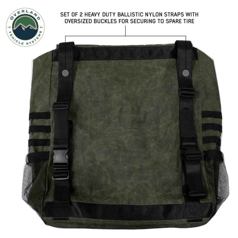Image of the back of a green and black backpack, highlighting a set of two heavy-duty ballistic nylon straps with oversized buckles for securing to a spare tire.