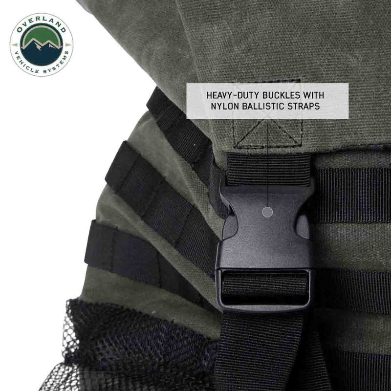 Image of a close-up on a heavy-duty buckle with a nylon ballistic strap on a green and black backpack.
