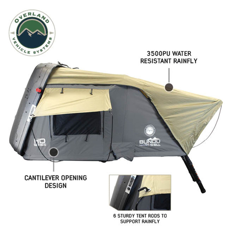 Image of Bundu Hard Shell Roof Top Tent in side view, featuring cantilever opening design, khaki 3500PU water-resistant rainfly, grey HD Series body, and six support rods, displayed on white background with Overland Vehicle Systems branding