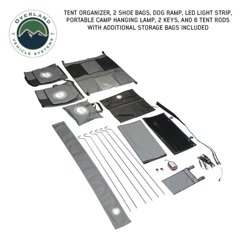 Image of Bundu HD Series roof top tent accessories kit, including tent organizer, two shoe bags, dog ramp, LED light strip, portable camp hanging lamp, two keys, six tent rods, and additional storage bags, all arranged neatly on a white background