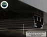 An image showing a close-up of the "PRE-INSTALLED MOUNTING RAIL. ALUMINUM, ADJUSTABLE, AND EASY TO USE" of the Bushveld Hard Shell Roof Top Tent, with a black and silver finish