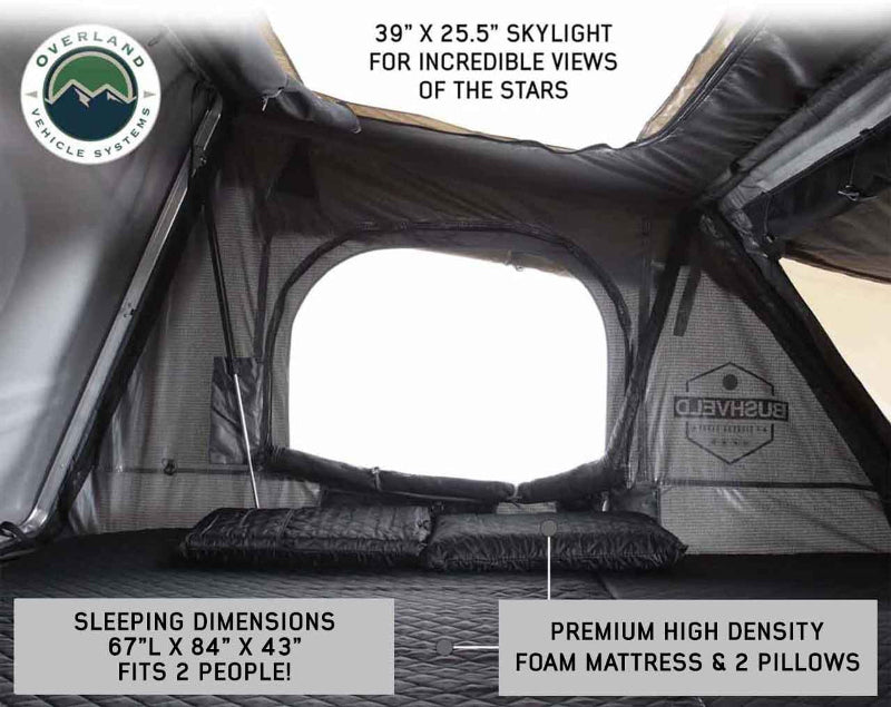 Image of OVS HD Bushveld II Hard Shell Roof Top Tent interior, showcasing a 39” x 25.5” skylight for stargazing, with sleeping dimensions of 67”L x 84”W x 43”H, featuring a premium high-density foam mattress and 2 pillows