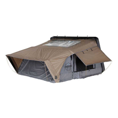 Image of OVS HD Bushveld II Cantilever Hard Shell Roof Top Tent, partially deployed with tan rainfly and grey body, showing an angled front and side view with open windows
