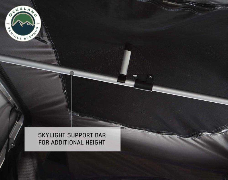 Image of OVS HD Bushveld II Hard Shell Roof Top Tent interior, featuring a skylight support bar for additional height, with black fabric ceiling and silver support bar