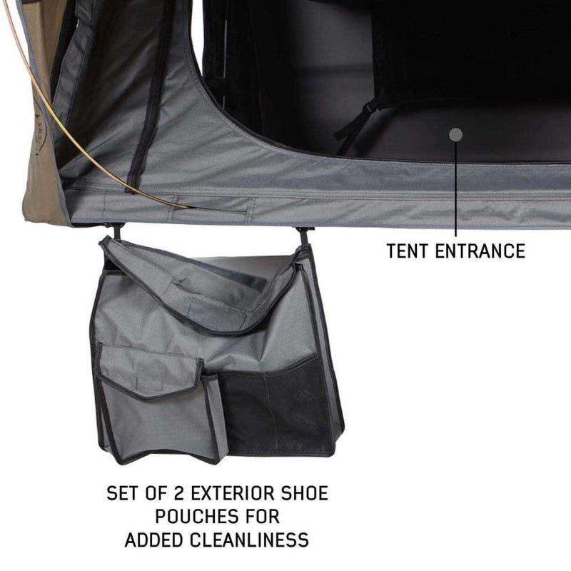 Image of OVS HD Bushveld II Hard Shell Roof Top Tent with tan rainfly and grey body, featuring the tent entrance and a set of two exterior shoe pouches for added cleanliness, shown in close-up
