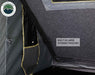 Image of Mamba Clam Shell Roof Top Tent showing built-in large storage pouches on the interior, close-up view of the pockets against the dark fabric background