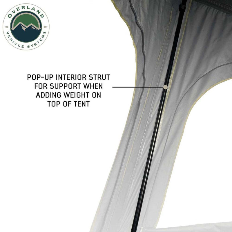 Image of Mamba Clam Shell Roof Top Tent showing the pop-up interior strut for support when adding weight on top of the tent, close-up view of the interior on a white background