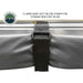 Image of a close-up on the Overland Vehicle Systems' Nomadic 180 Awning being secured for storage. A heavy-duty Velcro strap is wrapped around the folded gray awning fabric and aluminum frame to keep it in place