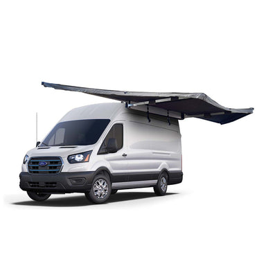 Image of the OVS Nomadic 180 Awning fully deployed on a white Ford van, dark grey fabric with a black underside, angled front and side view on a white background
