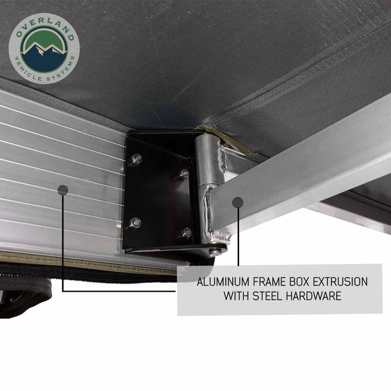 Image of the OVS Nomadic Awning showing a close-up of the aluminum frame box extrusion and the hinge point with steel hardware. The underside of the awning fabric is black