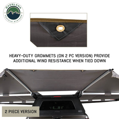 Image of OVS HD Nomadic 180 awning connector kit 2-piece version showing heavy-duty grommets for added wind resistance, light gray fabric panels installed over a vehicle, rear angled view on a white background.
