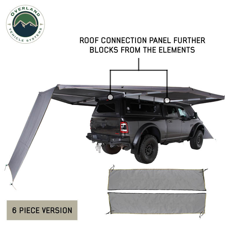Image of OVS HD Nomadic 180 awning connector kit 6-piece version showing roof connection panel blocking elements between dual awnings on a pickup truck, light gray fabric in an angled rear view on a white background.