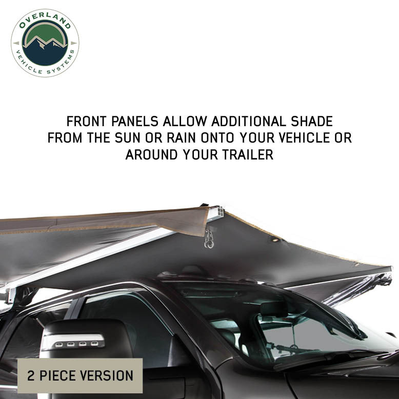 Image of OVS HD Nomadic 180 awning connector kit 2-piece version showing front shade panel extended over a vehicle, light gray fabric providing added sun and rain coverage, angled front side view on a white background.