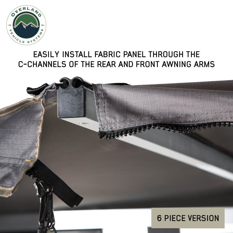Image of OVS HD Nomadic 180 awning connector kit 6-piece version detail showing fabric panel sliding into C-channel with zipper attachment, light gray material in a close-up angled view on a white background.