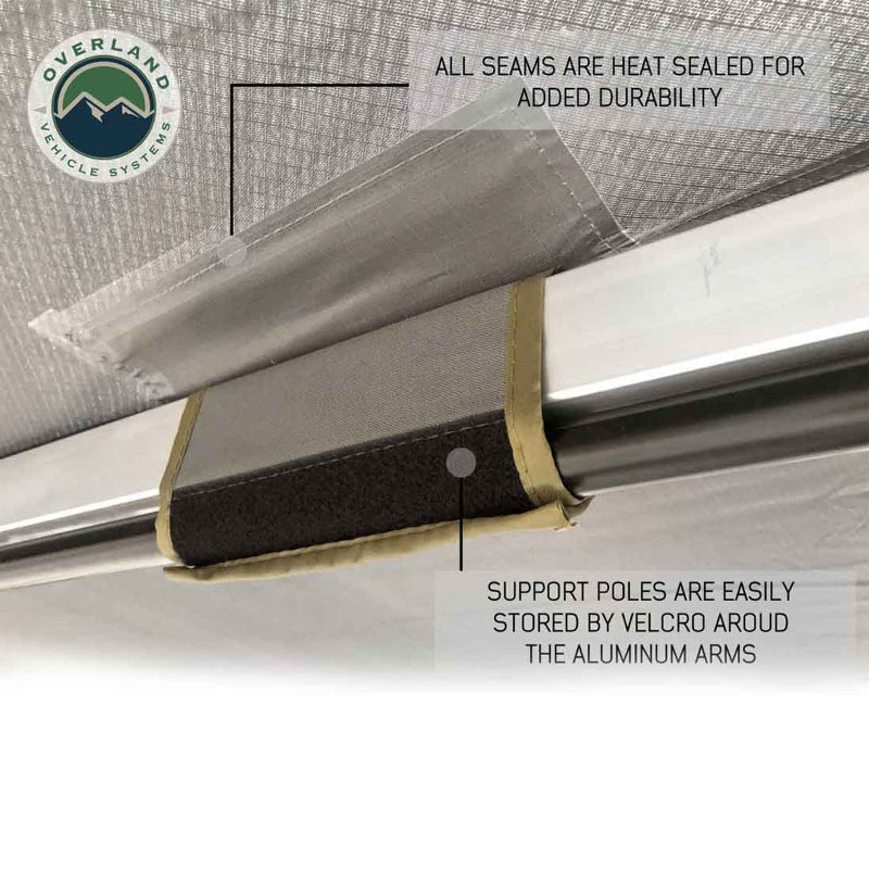 Image of a close-up of the interior of an Overland Vehicle Systems 270-degree awning, showing a support pole stored against the aluminum frame with a Velcro strap. The image highlights that all seams are heat-sealed for added durability