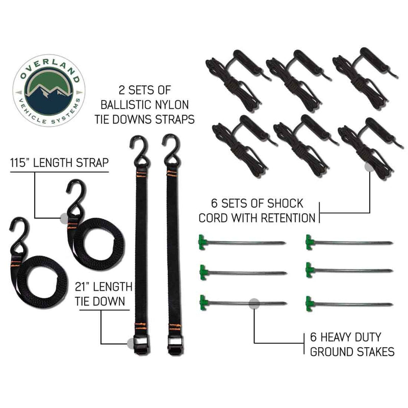Image of the included accessories for an Overland Vehicle Systems 270-degree awning, laid out on a white background. The image highlights two sets of ballistic nylon tie-down straps in a 115" and 21" length, six sets of shock cord with retention, and six heavy-duty ground stakes
