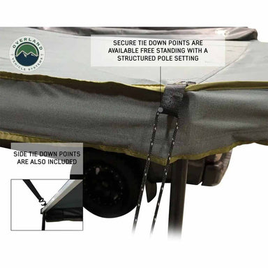 Image detailing the gray awning's secure tie-down points, which can be used for freestanding or pole-supported setups, and also highlighting the included side tie-down points