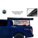 Image of a gray Nomadic 270 awning fully deployed to the side and rear of a vehicle, providing a large shaded area, from an overhead view on a white background