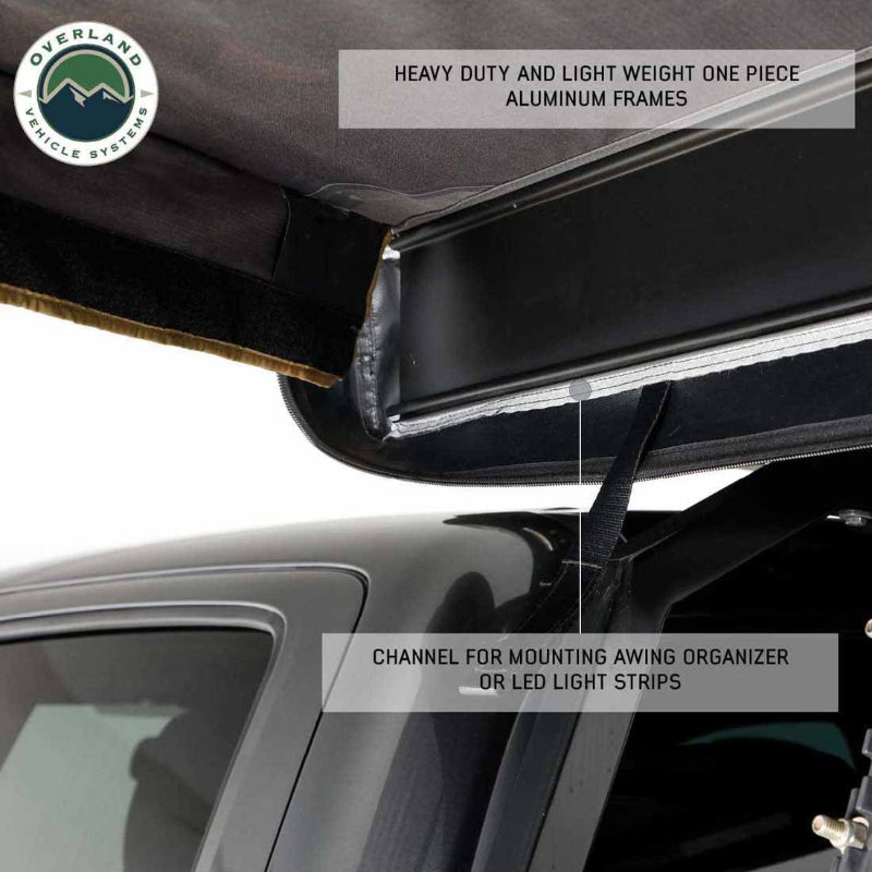 Image of a roof-mounted awning frame detail showing black one-piece aluminum housing with integrated channel for mounting LED light strips or organizers, close-up underside view on white background.