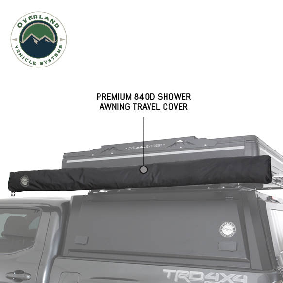 Image of an OVS HD Nomadic 2-person car-side shower and privacy room packed in a premium 840D travel cover and mounted on a roof rack, shown in side view on a white background.