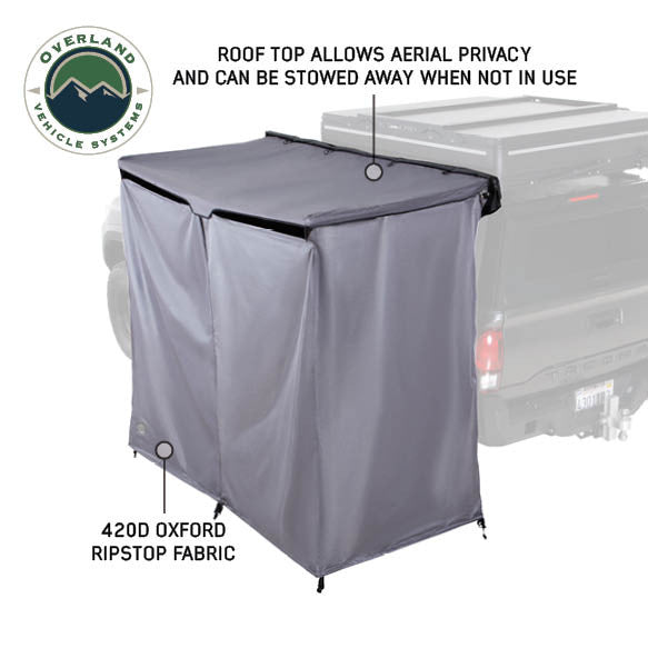 Image of an OVS HD Nomadic 2-person car-side shower and privacy room featuring a roof panel for added privacy and grey 420D ripstop fabric walls, shown in angled side view on a white background.