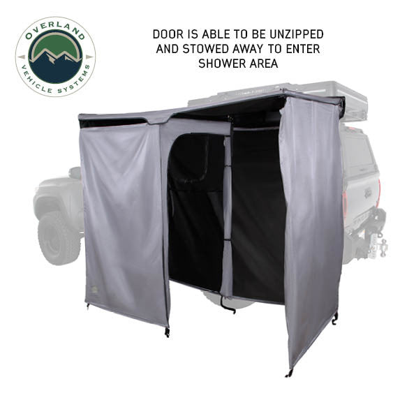 Image of an OVS HD Nomadic 2-person car-side shower and privacy room with the front door unzipped and stowed open for easy entry, grey and black fabric panels shown in angled front and side view on a white background.