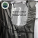 Image of a close-up of an OVS HD Nomadic 2-person car-side shower and privacy room interior showing an entry port for shower accessories and a built-in strap for hanging clothing, displayed on a white background.