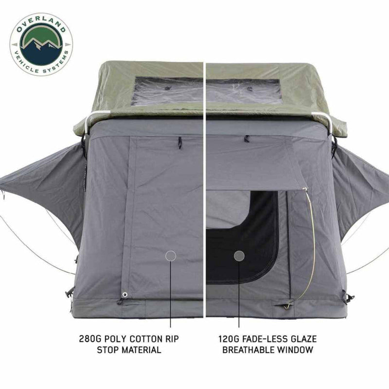 Image displaying a split view of an olive green rooftop tent, highlighting its 280G poly cotton rip stop material on one side and a 120G fade-less glaze breathable window on the other. The tent is shown fully deployed, with the "Overland Vehicle Systems" logo in the top left corner