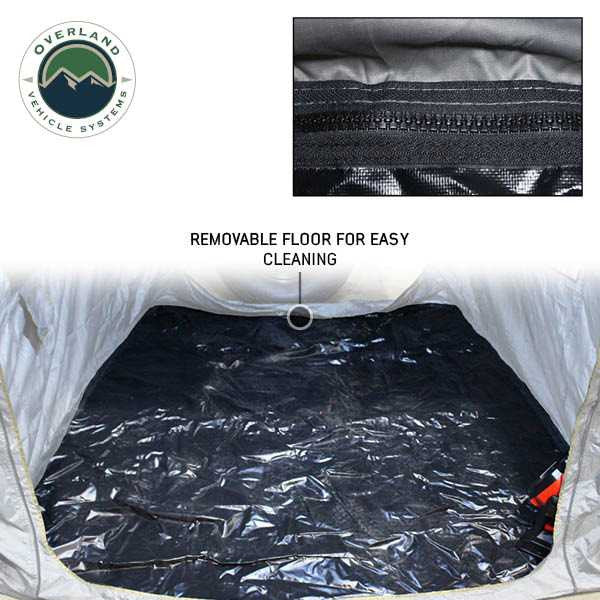 Image of the interior of a vehicle awning room enclosure highlighting a removable black waterproof floor with zipper detail for easy cleaning, shown from above on a white background.