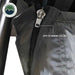 Image of a close-up of a grey awning room enclosure showing a zipper connection that attaches the wall panel to the awning ceiling, displayed in detail on a white background.