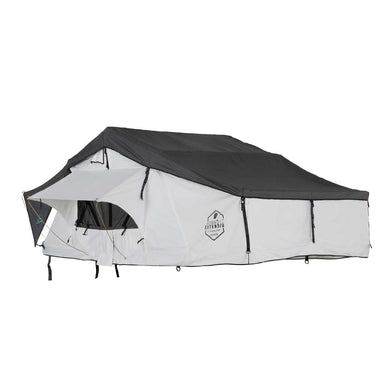 Image of a white Nomadic Extended rooftop tent with a dark grey roof cover, fully set up and extended, viewed from the front and side on a white background