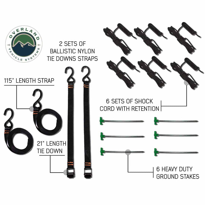 Image of the included hardware for the OVS Nomadic Awning, showing two sets of ballistic nylon tie-down straps, six sets of shock cords with retention hooks, and six heavy-duty ground stakes laid out on a white background