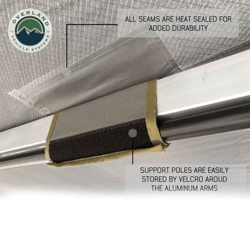 Image of the OVS Nomadic Awning showing a close-up of the support pole storage and heat-sealed seams for durability. The support poles are stored by Velcro straps wrapped around the aluminum arms