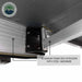 Image of the OVS Nomadic Awning showing a close-up of the aluminum frame box extrusion and the hinge point with steel hardware. The underside of the awning fabric is black