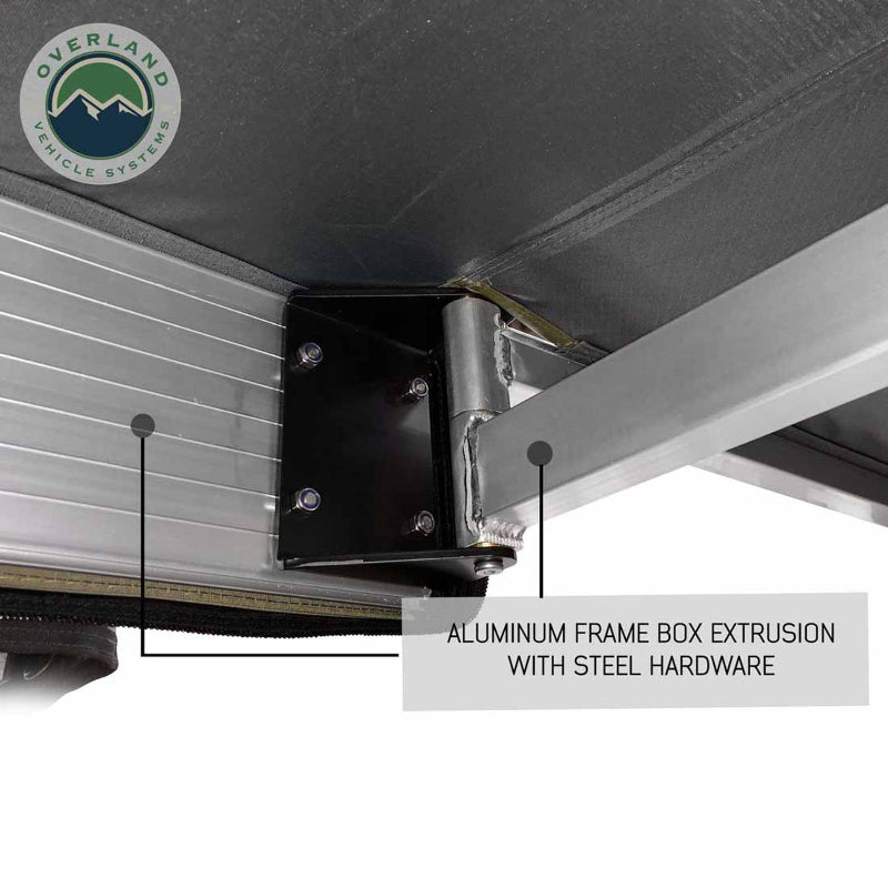 Image of the OVS Nomadic Awning showing a close-up of the aluminum frame box extrusion and the hinge point with steel hardware. The underside of the awning fabric is black