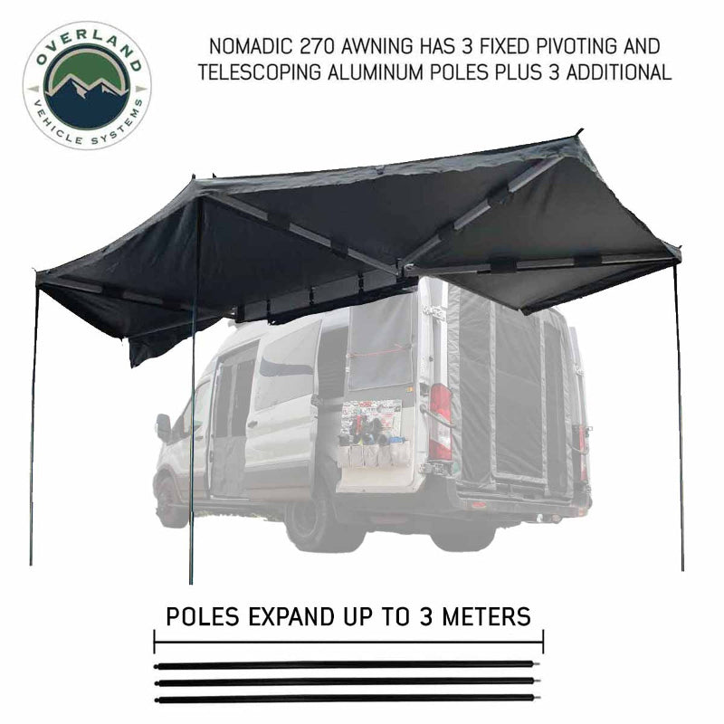 Image of the OVS Nomadic 270 Awning fully deployed on the side and rear of a vehicle, supported by three fixed pivoting and telescoping aluminum poles. The awning is black on both sides