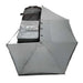 Image of the OVS Nomadic 270 Awning fully deployed from a vehicle, seen from a high angle to show the full 270-degree coverage of the light grey poly cotton ripstop canvas material